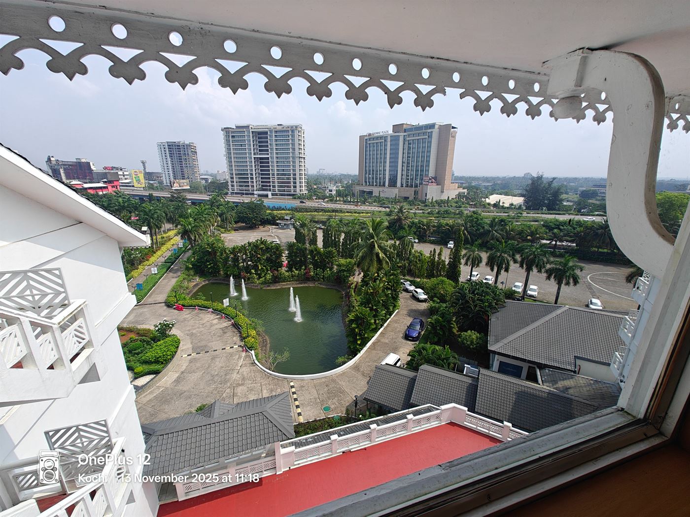 Daytime view over the hotel grounds, fountains and greenery