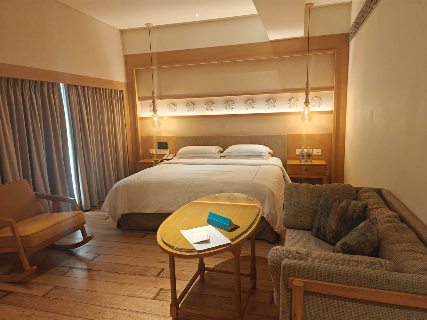 Superior King room with a rocking chair, sofa and desk