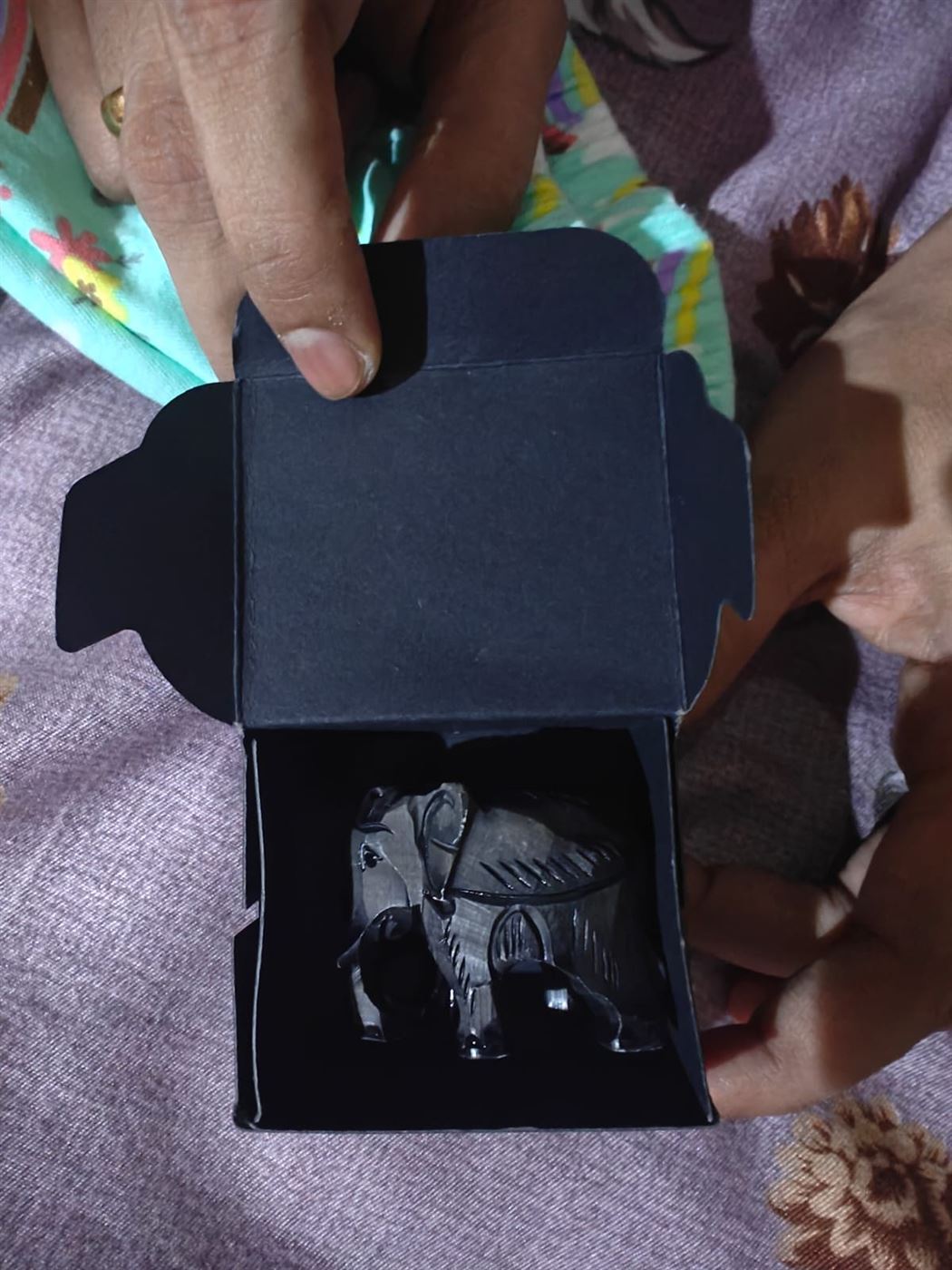 A small carved elephant keepsake in a gift box