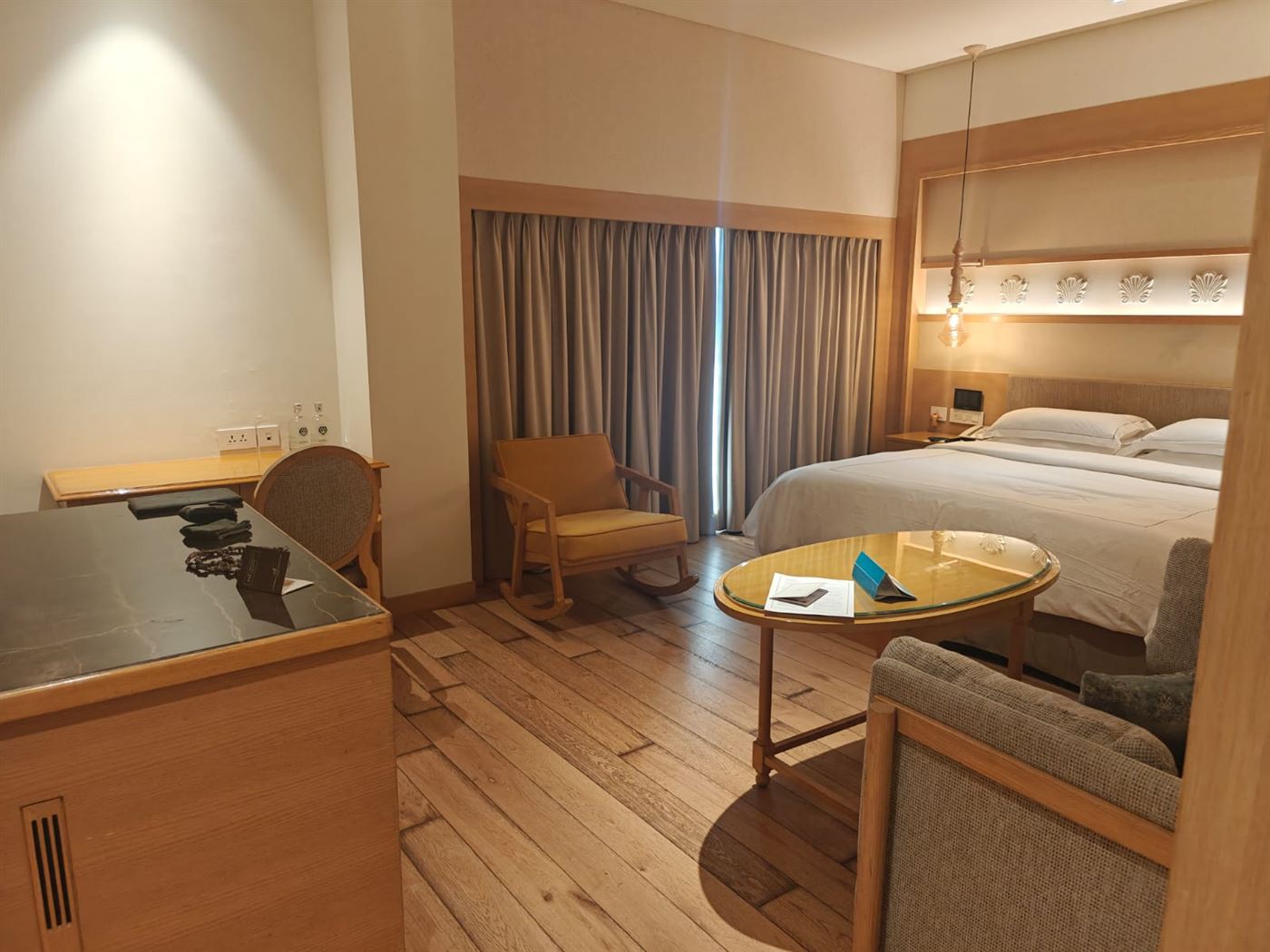 Another angle of the room with the writing desk and minibar