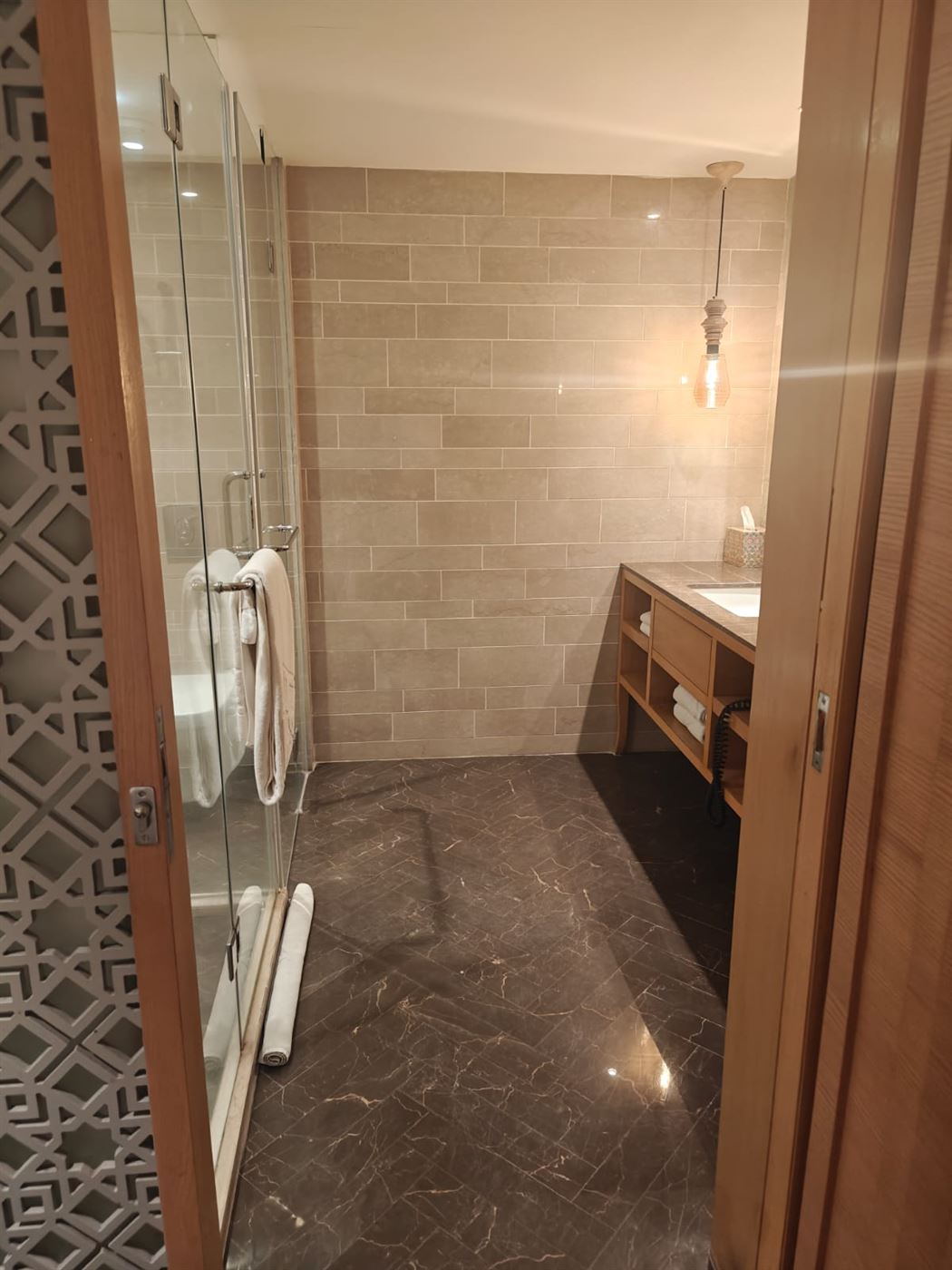 Shower and vanity area of the bathroom